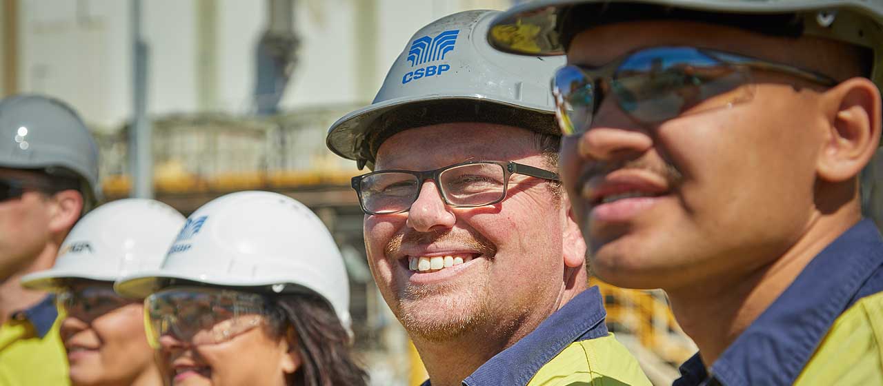 CSBP worker in hard hat smiling at camera