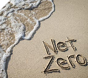 Net Zero written on beach sand